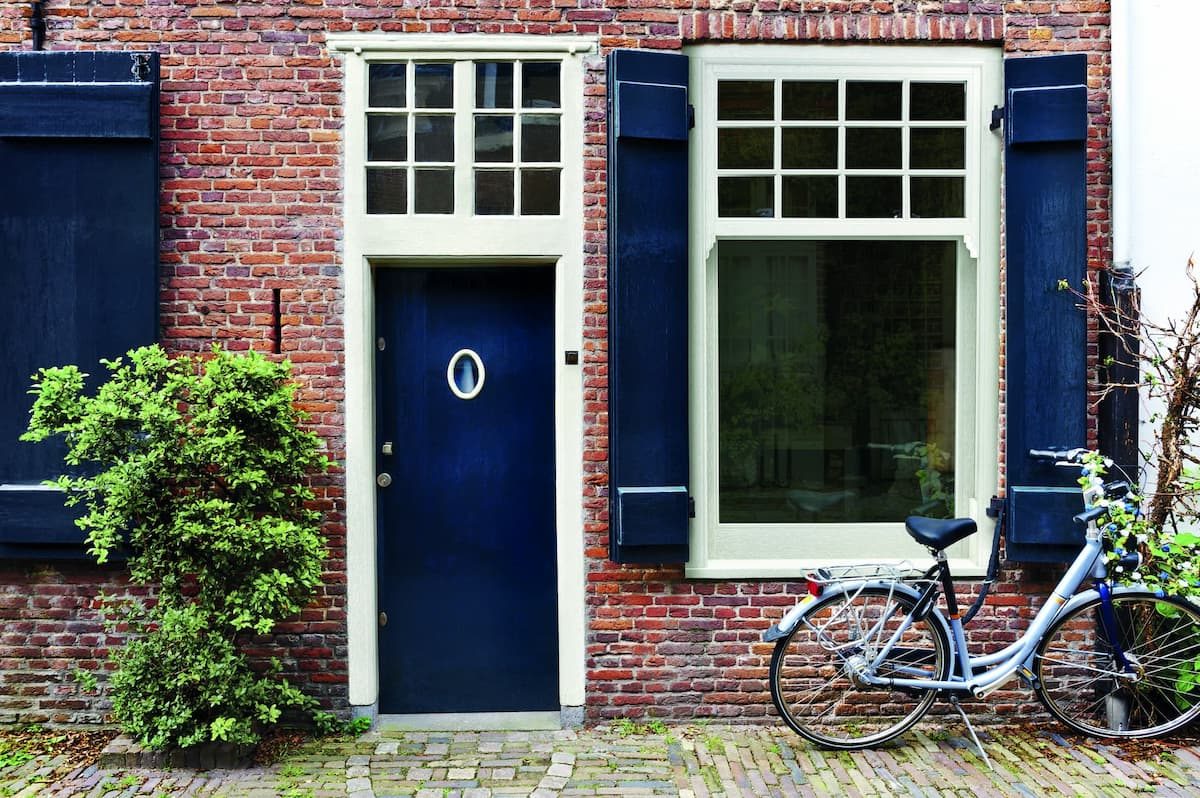Green sliding sash window in Midhurst